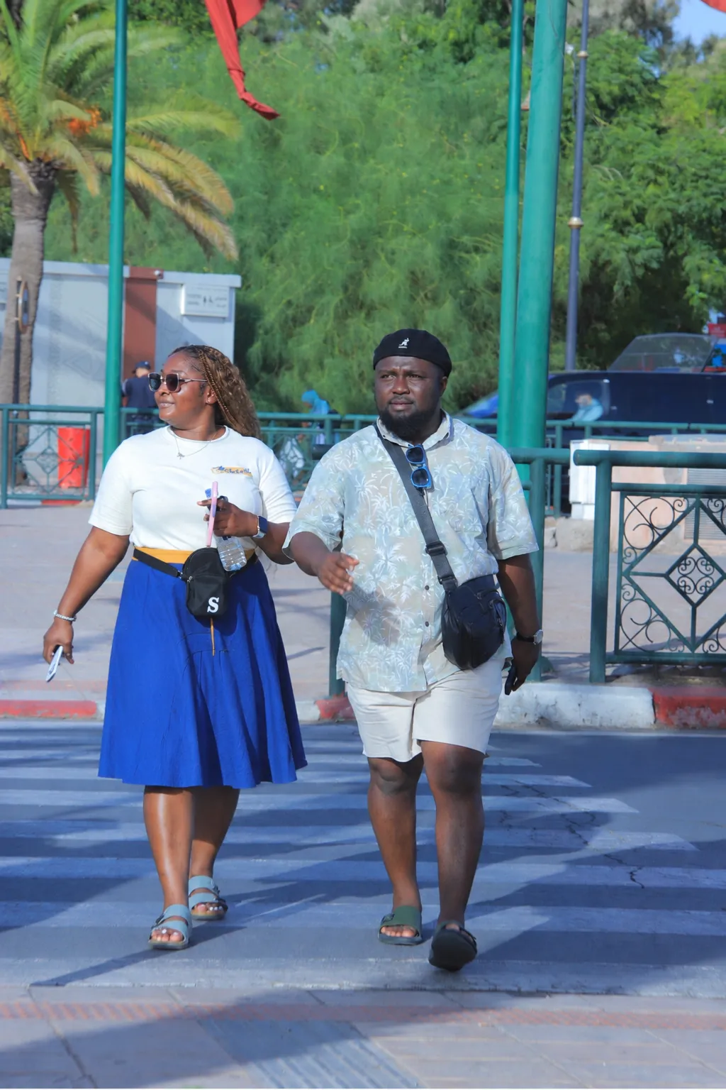 Ruth and Emmanuel crossing the road