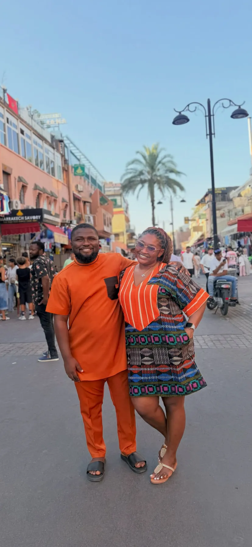 Emmanuel and Ruth on a city street